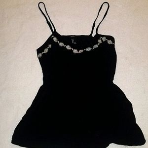 Black romper with embroidered floral detail